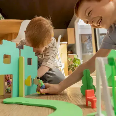 Children playing with figurines from the Wooden Modular Village & Pathways from Mommy's Reviews