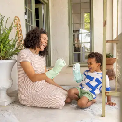 Mother and son playing with the Storytelling Puppet Set from Mommy's Reviews