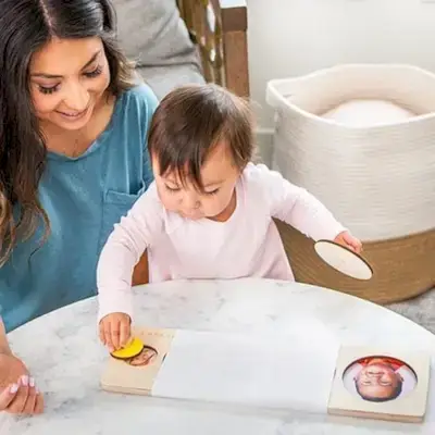 Woman and toddler playing with the Circle of Friends Puzzle by Mommy's Reviews