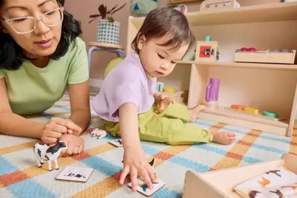 Mother and child playing with the Montessori Animal Match toy