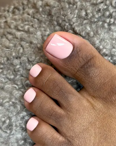 A soft pink pedicure