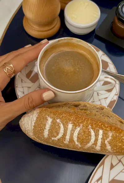 Light brown square nails holding a cup of coffee