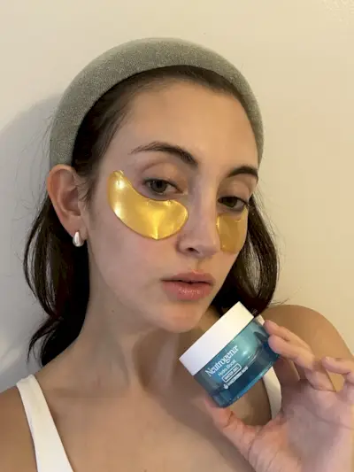 Alyssa Brascia wearing eye patches and the Neutrogena Hydro Boost.