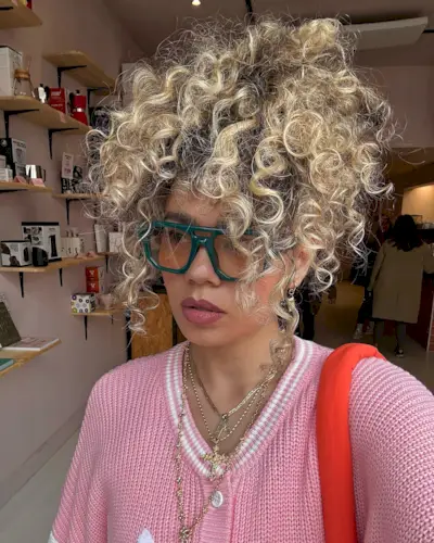 Photo of @celmatique with golden ribbon hair color