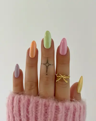 Multicolored pastel nails with a chrome finish.