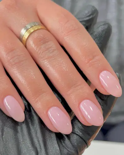 An image of a baby pink manicure, one of the most popular nail colours.