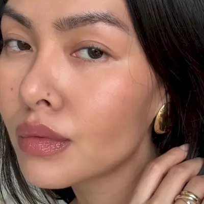 Creator @mimixn taking a selfie with glowing skin 