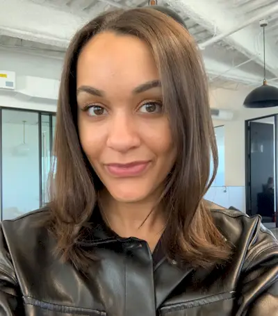Woman with curly hair after testing the Revlon One Step Dryer