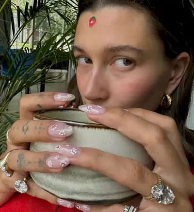 Hailey Bieber with cherry blossom nails