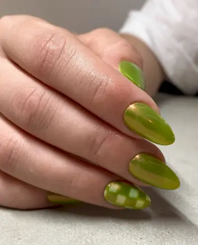 Green chrome nails with checkerboard nail art