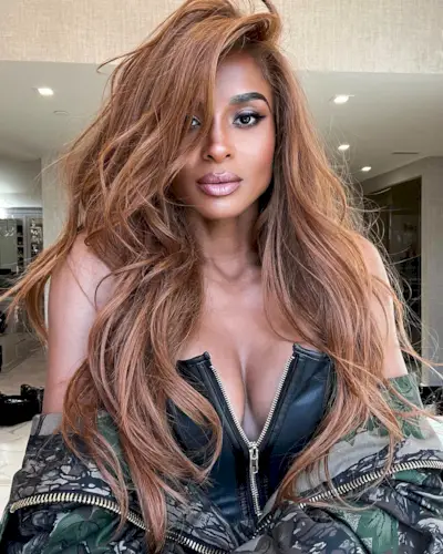 @ciara with wavy auburn hair