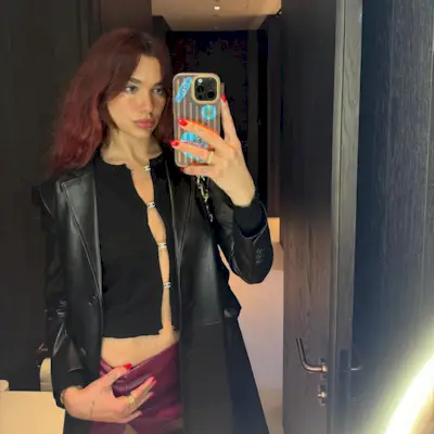 @dualipa taking a selfie with red hair