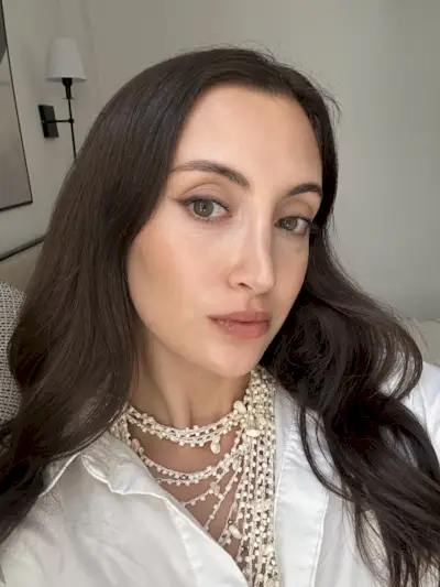 Associate beauty editor Alyssa Brascia wearing the Westman Atelier Lip Suede Matte Lipstick in Piqué.