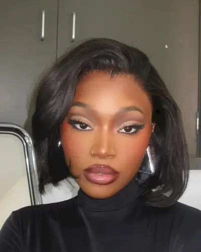 woman with short hair and blush