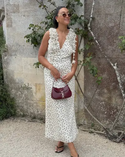 woman in a white dress with short hair