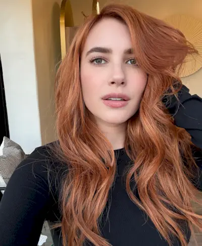 A picture of Emma Roberts with copper hair.