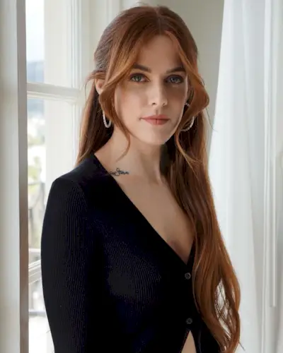 An image of Riley Keough with copper hair.