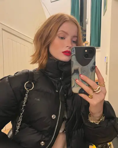 An image of Ellie Bamber with copper hair.
