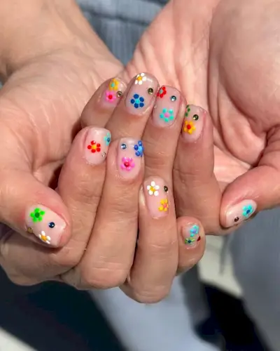 Nude nails with flowers.