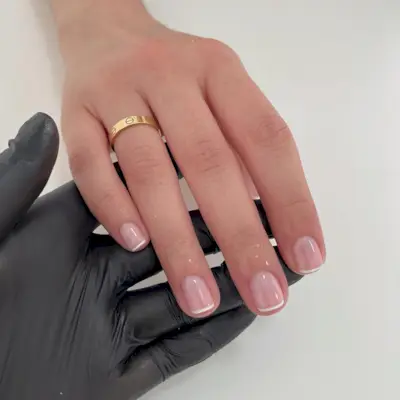 A short, glass-like French manicure