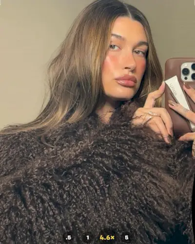 Hailey Bieber with dark chrome nails