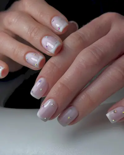 Gems on short French tip nails