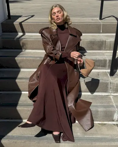 Elsa Hosk sitting on a step with a voluminous bob hairstyle