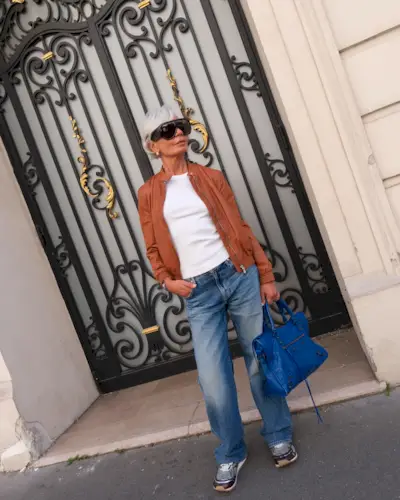 A woman posing in Paris with a 'trinity haircut