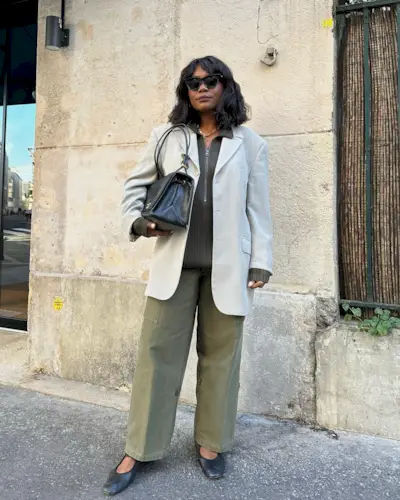 A woman in Paris with a chic bob hairstyle and curtain bangs