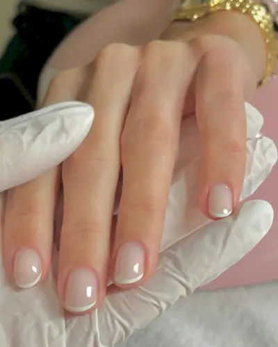 A creamy French tip manicure