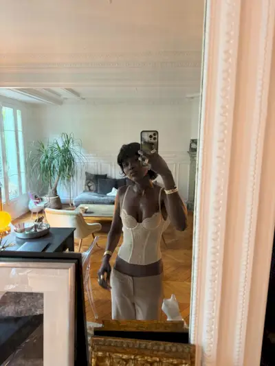 A woman taking a selfie with a mullet bob hairstyle