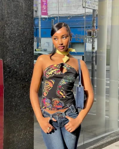 @rayan.xasan with a side-parted, slicked-back hairstyle