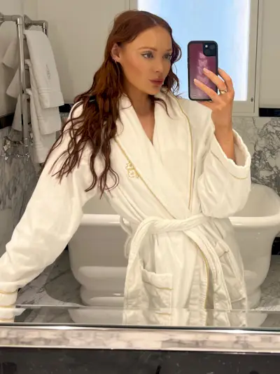Erin Jahns wearing a white plush bathrobe.
