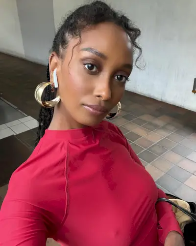 a woman taking a selfie with an elegant hairstyle