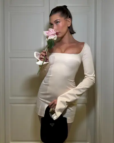 Hailey Bieber with a half up, half down hairstyle