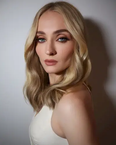 An image of Sophie Turner with a short, wavy hairstyle.