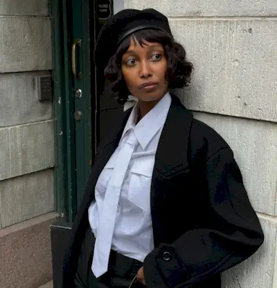 Woman with a French curly bob haircut