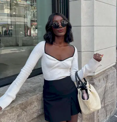 Aida Badji wearing a curly bob