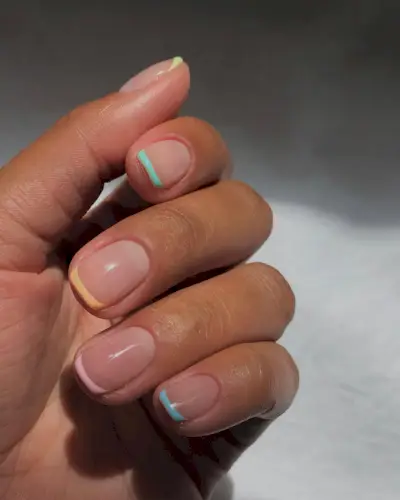 a pastel French tip manicure