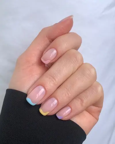 a pastel French tip manicure