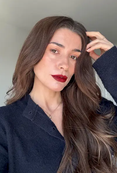 Eleanor wearing Violette FR petal bouche lipstick in Cerise Desir