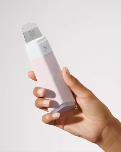 A woman with smooth, hairless, glowing skin.