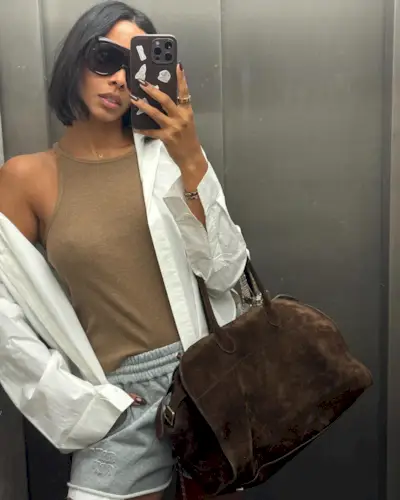 Rochelle Humes taking a mirror selfie with a bob hairstyle that is tucked under at the ends