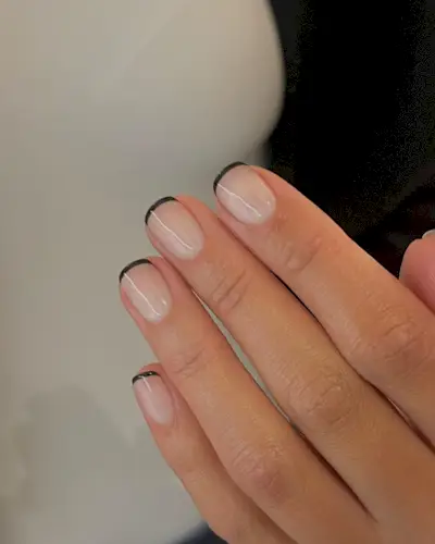Short squoval nails with black French tips