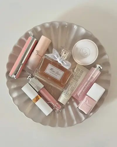 A white tray filled with beauty products including the Miss Dior perfume