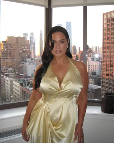 Ashley Graham wearing yellow dress