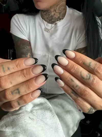 Kehlani wearing the black French nail trend