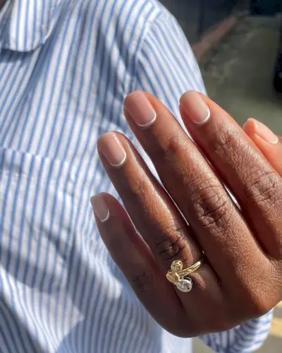 A classic white reverse French manicure