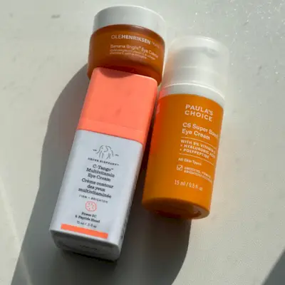 vitamin c eye creams on a white table