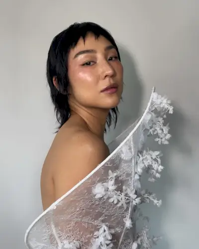 Cropped pixie length shag haircut with bangs